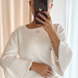 Pull with pearl sleeves