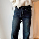 Jeans with strap