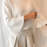 Pull with pearl sleeves