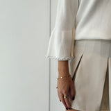 Pull with pearl sleeves