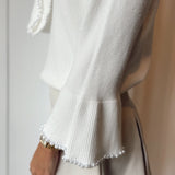 Pull with pearl sleeves