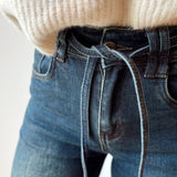 Jeans with strap