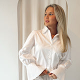 White flaired blouse